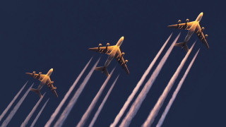 Four airplanes flying formation contrails - behind them free wallpaper