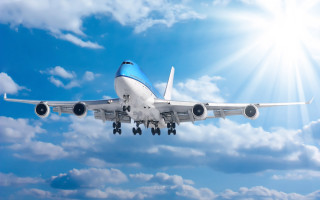 Jetliner flying blue sky clouds 15 - a blue cloudy sky free wallpaper