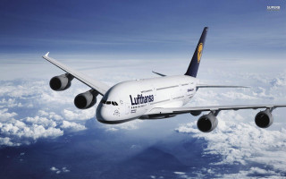 Jetliner flying blue sky clouds 11 - area free wallpaper