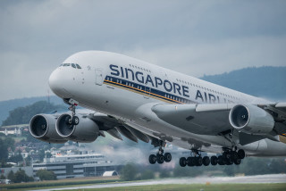 Jetliner takeoff smoke international style - gear free wallpaper
