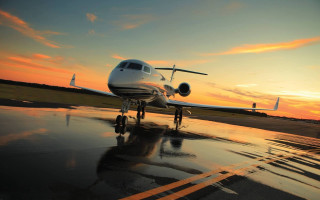 Small plane wet runway sunset 2 - wet free wallpaper