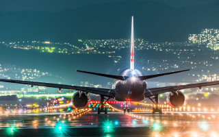 Jetliner night sky runway lights - a stock photo free wallpaper