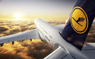 Jetliner cloudy sky sunset yellow 3 - a cloudy sky above the clouds free wallpaper