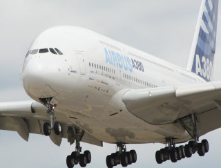 Large white airplane cloudy sky 2 - the side of the plane free wallpaper