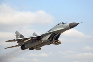 Fighter jet cloudy sky smoke 2 - a cloudy blue sky free wallpaper