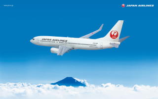 Japan airlines plane clouds mountain - international typographic style free wallpaper