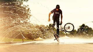 Man bike water trick sunset - a trick free wallpaper