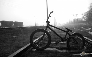 Bicycle parked railroad track train - a bicycle free wallpaper