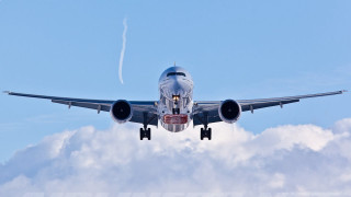 Jetliner flying blue sky cloudy - gear free wallpaper