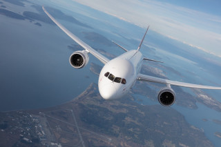 Jetliner flying blue sky water - professional photo free wallpaper