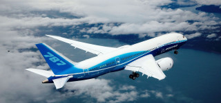 Jetliner cloudy sky ocean flying - the side of the plane free wallpaper