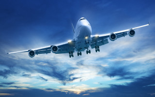 Jetliner flying cloudy sky sun 4 - a cloudy blue sky free wallpaper