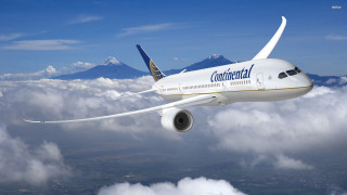 Airplane flying sky clouds mountains - a mountain range in the distance free wallpaper