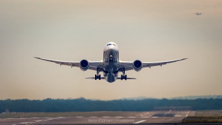 Jetliner flying cloudy sky runway - an airport free wallpaper