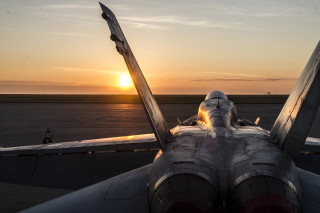 Jet fighter airplane airport tarmac - a jet fighter plane free wallpaper