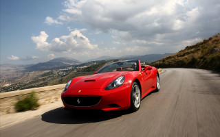 Red sports car driving road 15 - the sky above free wallpaper