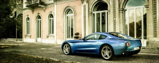 Blue sports car clocktower building - the doorway free wallpaper