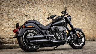 Black motorcycle brick wall building - a brick wall behind free wallpaper