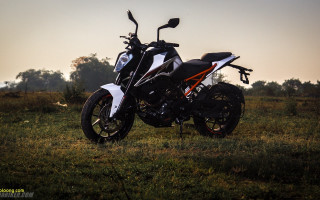 Motorcycle parked field grass trees - sunset free wallpaper for desktop