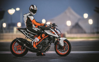 Motorcycle person night street lights - a street free wallpaper